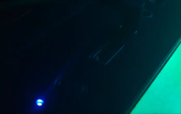 RGB gaming headset on desk with ambient lighting
