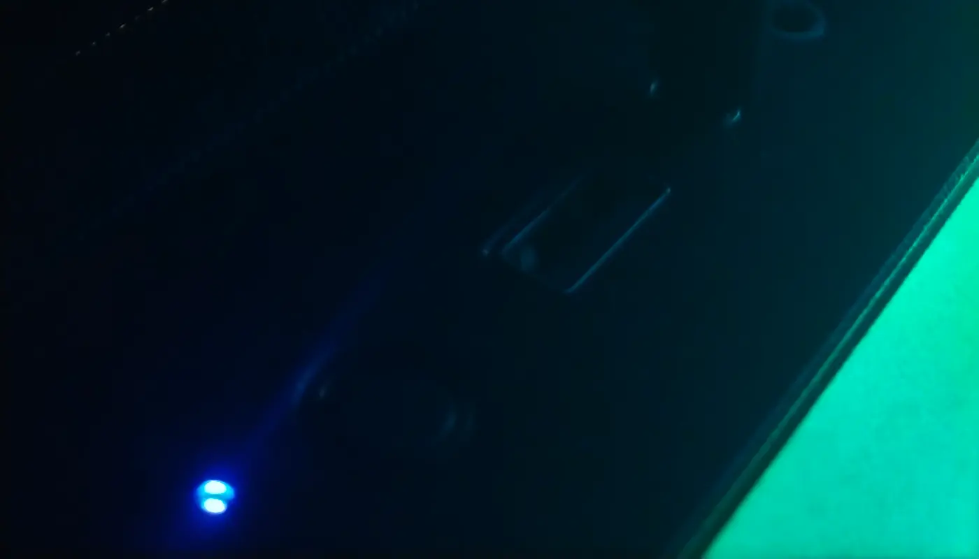 RGB gaming headset on desk with ambient lighting